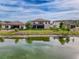 Aerial view of the house with a pond in the backyard at 4024 Woods Rider Loop, Odessa, FL 33556