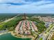 Aerial view of residential area with homes, lakes, and roadways at 4024 Woods Rider Loop, Odessa, FL 33556