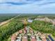 Residential area with greenery landscape, ponds, and trees surrounding houses at 4024 Woods Rider Loop, Odessa, FL 33556