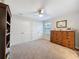 Bedroom featuring traditional dresser, double closets, and a ceiling fan at 4024 Woods Rider Loop, Odessa, FL 33556