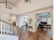 Welcoming foyer with hardwood floors, staircase, and views into adjacent rooms at 4024 Woods Rider Loop, Odessa, FL 33556