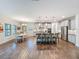 Spacious open-concept kitchen with island seating, stainless appliances, and a dining area for casual gatherings at 4024 Woods Rider Loop, Odessa, FL 33556