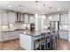 Modern kitchen with gray cabinets, stainless steel appliances, and a center island at 4024 Woods Rider Loop, Odessa, FL 33556