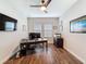 Office with hardwood floors, ceiling fan, natural light, and desk at 4024 Woods Rider Loop, Odessa, FL 33556