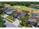 Aerial view showcases the property's location, landscaping, and proximity to the golf course at 5113 Epping Ln, Zephyrhills, FL 33541