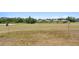 Expansive backyard bordering a golf course, offering plenty of space and scenic views of the surrounding neighborhood at 5113 Epping Ln, Zephyrhills, FL 33541