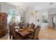 Formal dining room featuring a chandelier, elegant decor, and a large dining table at 5113 Epping Ln, Zephyrhills, FL 33541