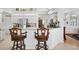 Bright kitchen with stainless steel appliances, breakfast bar, and decorative elements at 5113 Epping Ln, Zephyrhills, FL 33541