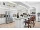 Modern kitchen with stainless appliances, breakfast bar, and open-concept design at 5113 Epping Ln, Zephyrhills, FL 33541
