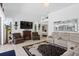 Bright living room featuring tile flooring, a fireplace, and multiple seating areas at 5113 Epping Ln, Zephyrhills, FL 33541