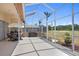 Relaxing screened patio with outdoor kitchen and golf course views, perfect for entertaining or enjoying the serene surroundings at 5113 Epping Ln, Zephyrhills, FL 33541