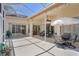 Covered patio area with dining furniture, comfortable seating, lighting, ceiling fan and clear view of the sky at 5113 Epping Ln, Zephyrhills, FL 33541