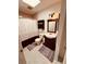 Cozy bathroom featuring a shower-tub combo, a pedestal sink, and tiled floors at 5407 Sweetwater Terrace Cir # 5407, Tampa, FL 33634