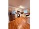 Spacious kitchen featuring stainless steel appliances, ample cabinet space, and wood flooring at 5407 Sweetwater Terrace Cir # 5407, Tampa, FL 33634
