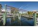 Private boat lift with waterfront access, surrounded by lush tropical landscaping at 5807 Cay Cove Ct, Tampa, FL 33615
