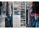 Walk-in closet features custom shelving, drawers, and lots of storage space at 5807 Cay Cove Ct, Tampa, FL 33615