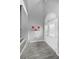 Bright foyer with wood-look tile flooring and staircase at 5807 Cay Cove Ct, Tampa, FL 33615