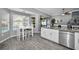 Spacious kitchen features a breakfast nook, granite countertops, stainless appliances, and pool view at 5807 Cay Cove Ct, Tampa, FL 33615