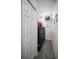 Laundry room featuring gray wood look floor, washer and dryer, shelves and storage at 5807 Cay Cove Ct, Tampa, FL 33615