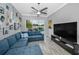Spacious living area with modern decor and sliding glass doors leading to the pool at 5807 Cay Cove Ct, Tampa, FL 33615
