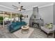 Cozy living room features a stone fireplace, comfortable seating, and sliding doors to a patio at 5807 Cay Cove Ct, Tampa, FL 33615
