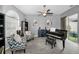 Stylish living room featuring a piano, comfortable seating, and modern decor at 5807 Cay Cove Ct, Tampa, FL 33615