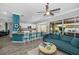 Open living space showcases a modern kitchen, bar seating, and comfortable living area with pool views at 5807 Cay Cove Ct, Tampa, FL 33615