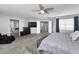 Large main bedroom featuring gray color palette and wood-look tile, offering ample space and natural light at 5807 Cay Cove Ct, Tampa, FL 33615
