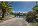 Scenic waterfront homes and a boat dock under a clear blue sky at 5807 Cay Cove Ct, Tampa, FL 33615