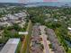 An aerial view of a residential community, nestled amongst trees, near the Pinellas County Trail at 597 Ozona Village Dr, Palm Harbor, FL 34683
