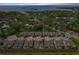 Excellent aerial view of property, showing neighborhood, pond, and proximity to the bay at 597 Ozona Village Dr, Palm Harbor, FL 34683