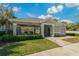 Community clubhouse offers residents a gathering place with outdoor seating and landscaped surroundings at 597 Ozona Village Dr, Palm Harbor, FL 34683