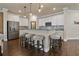 Modern kitchen with stainless steel appliances, granite countertops, and a breakfast bar with seating at 597 Ozona Village Dr, Palm Harbor, FL 34683
