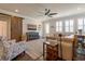 Inviting living room with stylish furnishings, barn door, and modern ceiling fan at 597 Ozona Village Dr, Palm Harbor, FL 34683