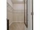 Walk-in closet with carpeted floor, metal shelving, and a full length mirror on the door at 597 Ozona Village Dr, Palm Harbor, FL 34683