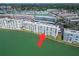 An aerial view of a waterfront apartment complex and neighboring residential buildings at 5980 Shore S Blvd # 403, Gulfport, FL 33707