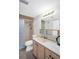 Well-lit bathroom featuring a shower with glass door, marble vanity top, and neutral design at 5980 Shore S Blvd # 403, Gulfport, FL 33707