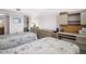 Inviting bedroom featuring two twin beds, a spacious closet, and a built-in desk area at 5980 Shore S Blvd # 403, Gulfport, FL 33707