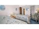 The guest bedroom features two beds and cozy chair for relaxing at 5980 Shore S Blvd # 403, Gulfport, FL 33707