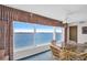 Cozy dining area with large windows offering panoramic views of the bay at 5980 Shore S Blvd # 403, Gulfport, FL 33707