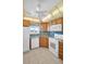 The kitchen offers lots of cabinet space and white appliances at 5980 Shore S Blvd # 403, Gulfport, FL 33707