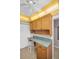 Compact kitchen with a countertop and ample upper and lower cabinets at 5980 Shore S Blvd # 403, Gulfport, FL 33707