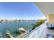 Waterfront condo view from balcony showcasing boat docks and serene blue waters with clear skies at 600 Bayway Blvd # 304, Clearwater, FL 33767