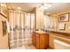 Cozy bathroom with shower-tub combination and vanity with decorative granite countertop at 600 Bayway Blvd # 304, Clearwater, FL 33767