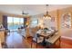 The dining area merges with the living space, showcasing water views and creating an airy, connected atmosphere at 600 Bayway Blvd # 304, Clearwater, FL 33767