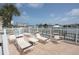 Spacious patio featuring lounge chairs and views of the water and marina at 600 Bayway Blvd # 304, Clearwater, FL 33767