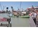 Scenic view of a bustling waterfront area with boats, charters, and people enjoying the day at 600 Bayway Blvd # 304, Clearwater, FL 33767
