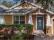 Inviting home with vibrant front door, manicured landscaping, and a welcoming entrance at 6018 Gannetdale Dr, Lithia, FL 33547