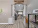Inviting hallway with arched entryway, elegant columns, and warm neutral tones throughout the home at 6018 Gannetdale Dr, Lithia, FL 33547