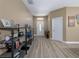 Inviting foyer with laminate floors, shelving, and a welcoming entrance at 6018 Gannetdale Dr, Lithia, FL 33547
